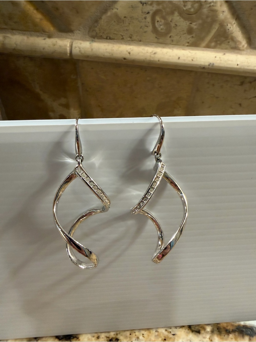 Touchstone Crystal Silver Twisted Drop Earrings with Crystal Accents - Picture 2 of 5